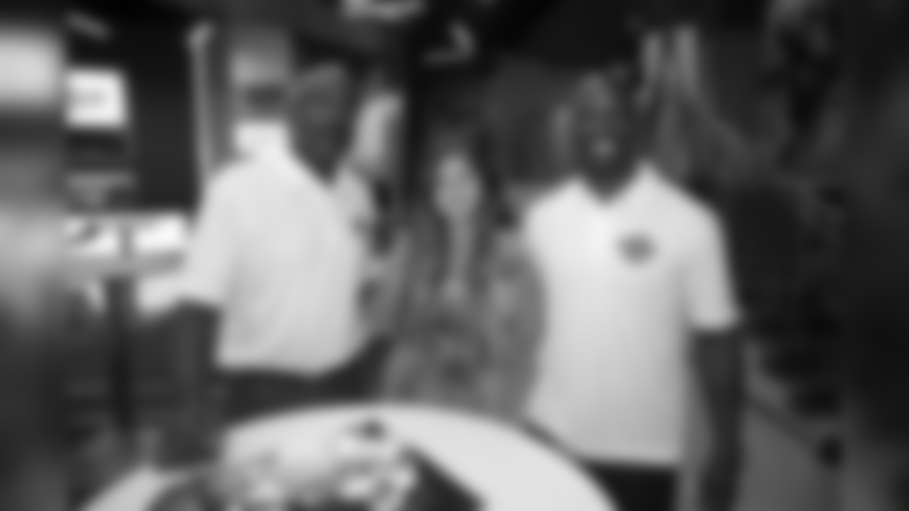 Mike Quick and Jason Avant with a lucky fan.