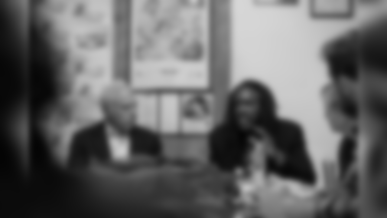 Lurie sits next to Jondhi Harrell, founder and executive director of The Center for Returning Citizens.