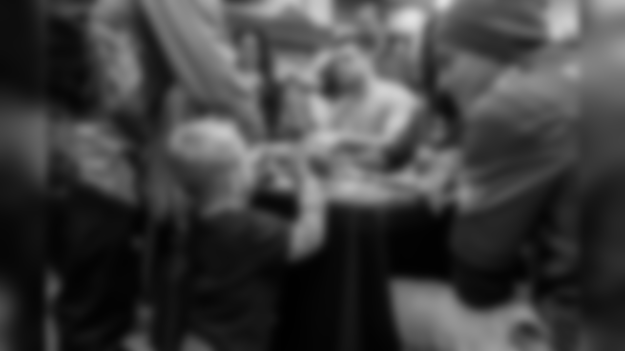 WR Mack Hollins has a conversation with one of the children during an autograph session.