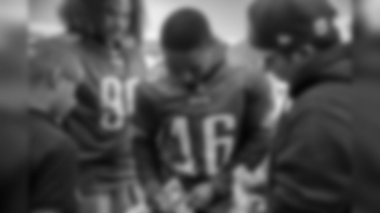 WR Rashard Davis signs an autograph.
