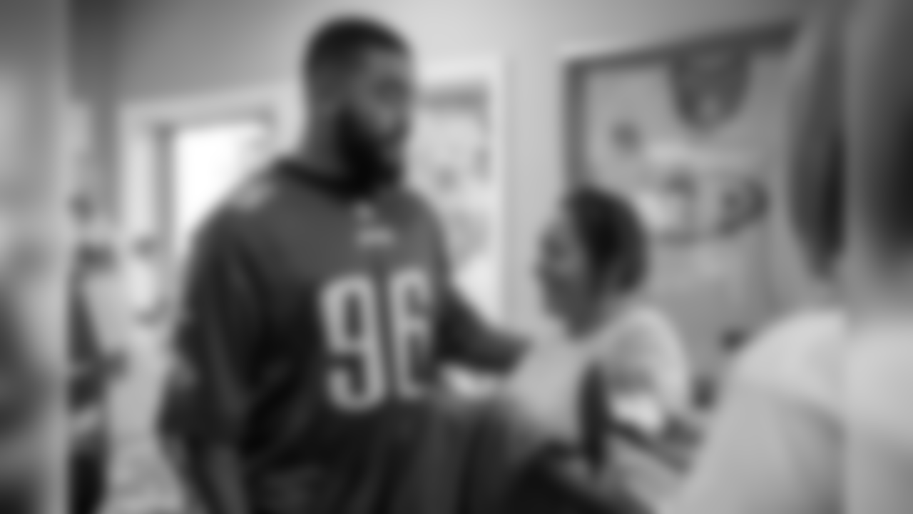 DE Derek Barnett meets a parent inside the Orange County Ronald McDonald House.