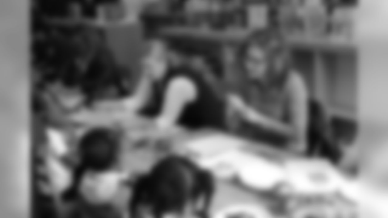 Fort Stewart Women’s Association and Atlanta Falcons Women’s Association making Gold Star Ornaments at an Elementary School with students for the living fallen soldier memorial at Fort Stewart.