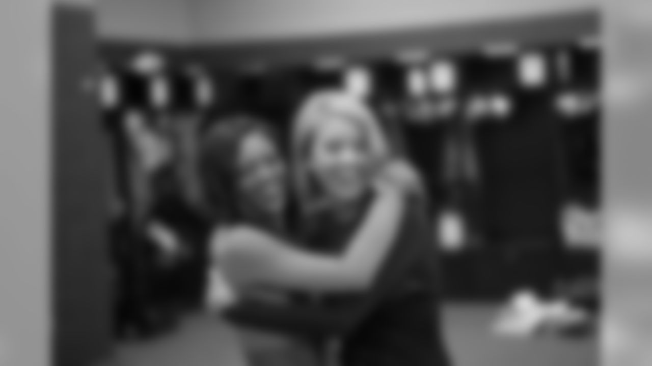 Shannon and Annalise hug each other in between photo sessions