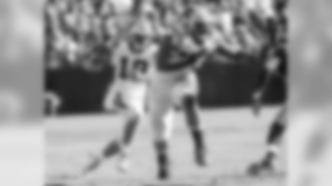 WR Ted Ginn, Jr. and T Michael Oher