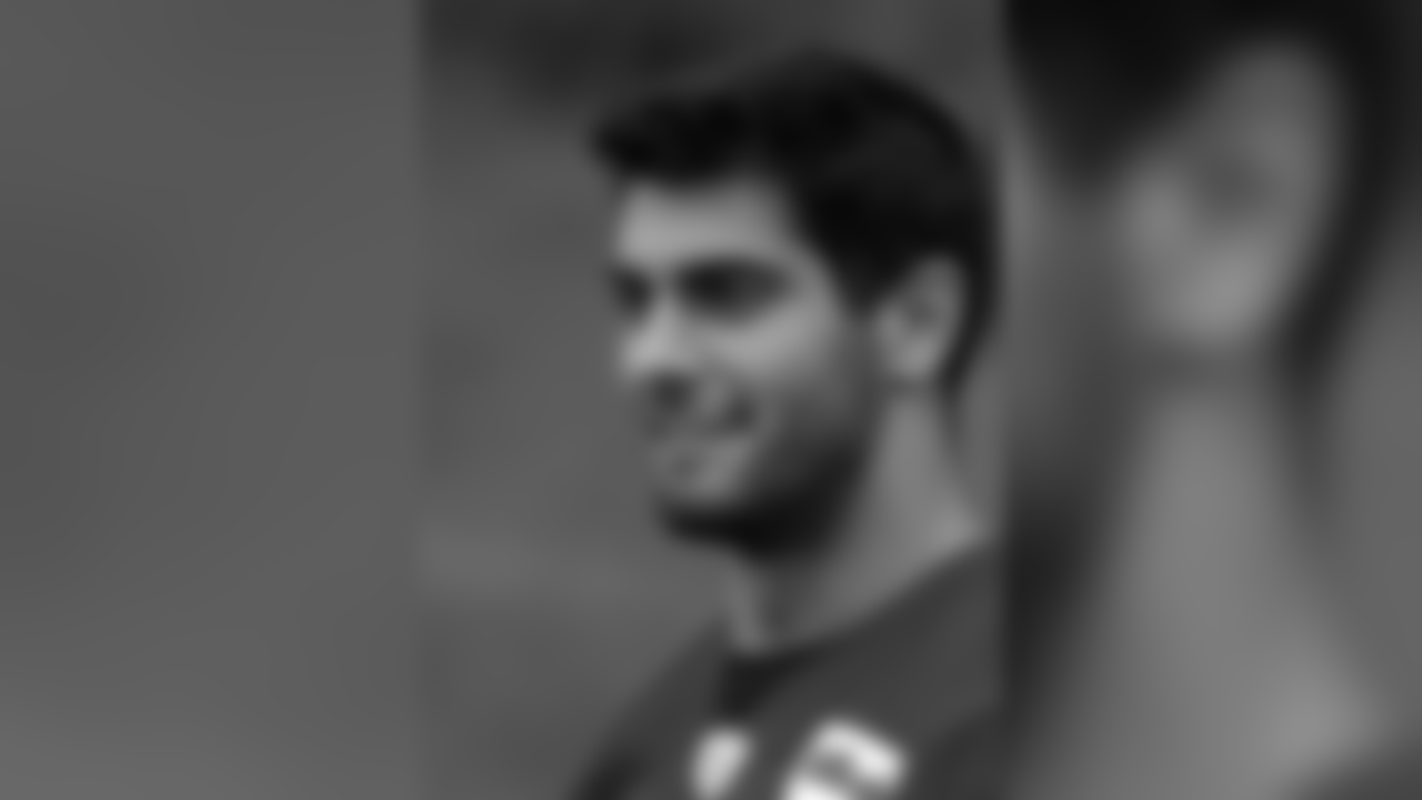 New England Patriots quarterback Jimmy Garoppolo walks onto the field for an NFL football organized team activities practice Thursday, May 25, 2017, in Foxborough, Mass. (AP Photo/Bill Sikes)