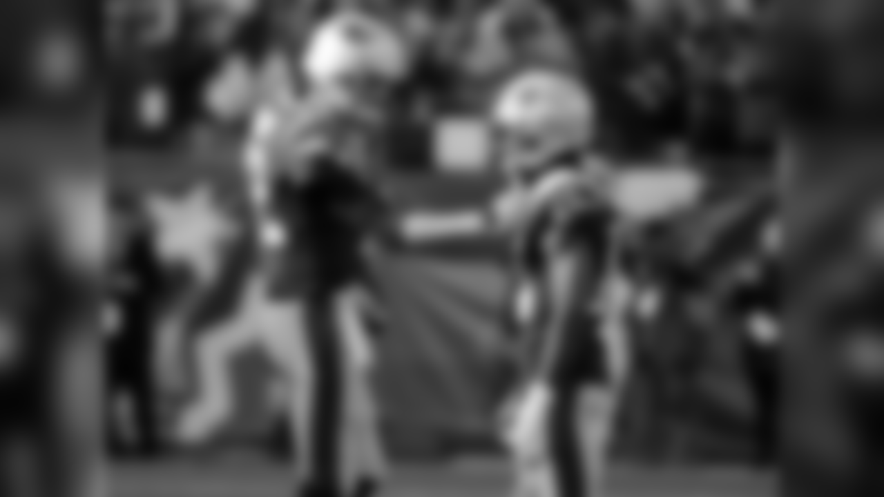 New England Patriots quarterback Tom Brady, left, talks to wide receiver Brandin Cooks as they warm up before the AFC championship NFL football game against the Jacksonville Jaguars, Sunday, Jan. 21, 2018, in Foxborough, Mass. (AP Photo/David J. Phillip)