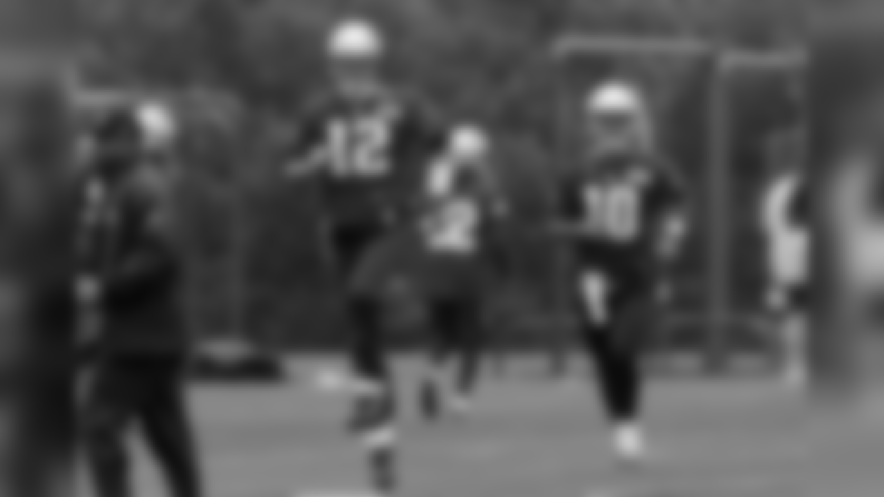 New England Patriots quarterbacks Tom Brady (12) and Jimmy Garoppolo (10) run through a drill during an NFL football organized team activities practice Thursday, May 25, 2017, in Foxborough, Mass. (AP Photo/Bill Sikes)