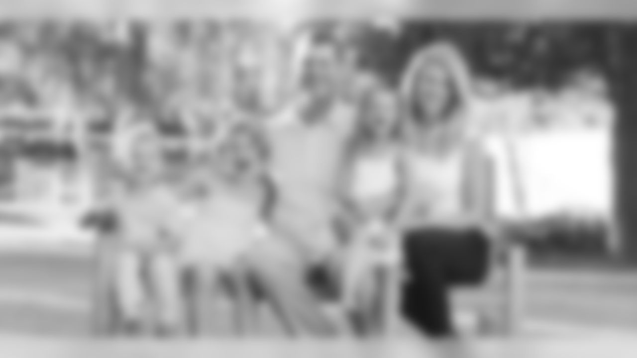 Jim and Sarah Harbaugh with their three kids.
