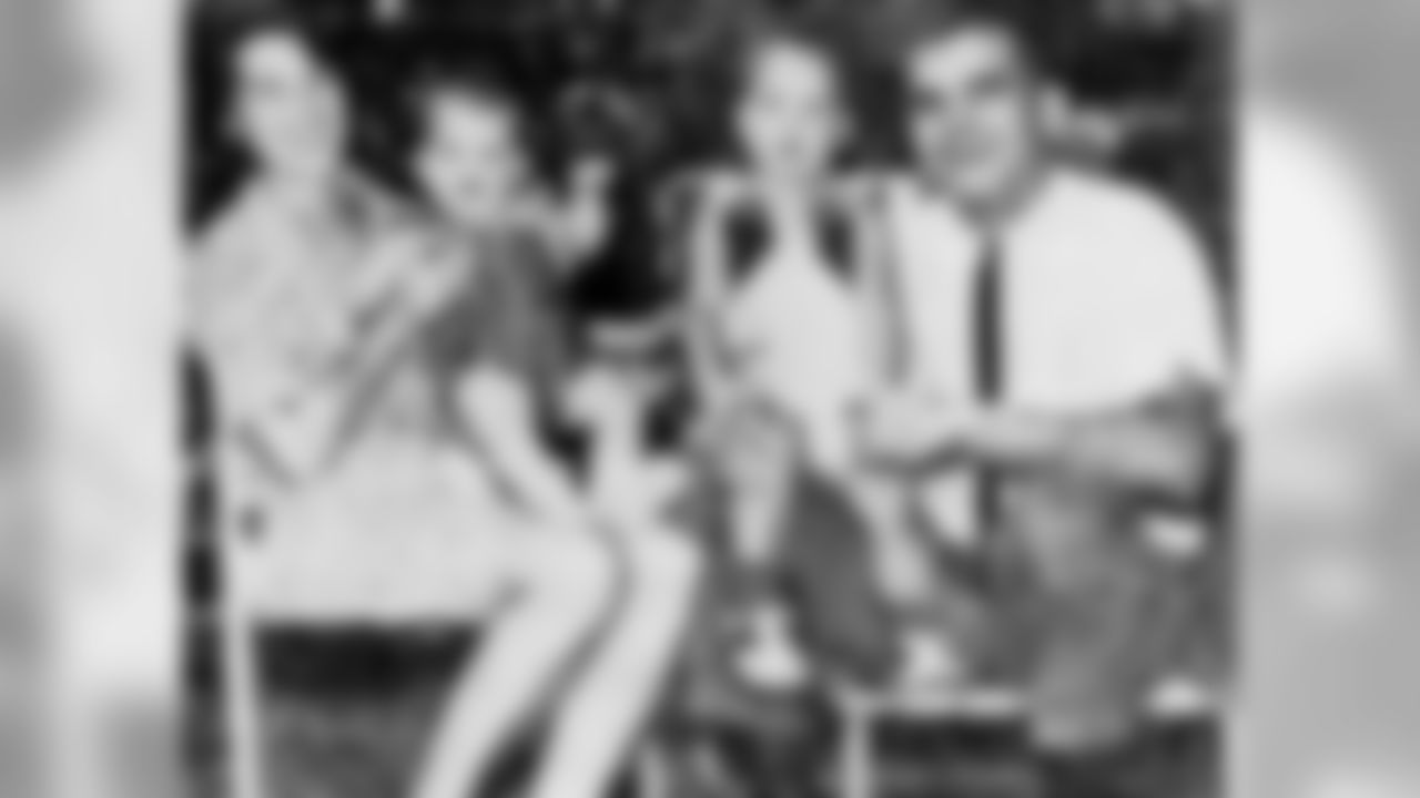 Jackie and Jack Harbaugh with a young Jim and John.