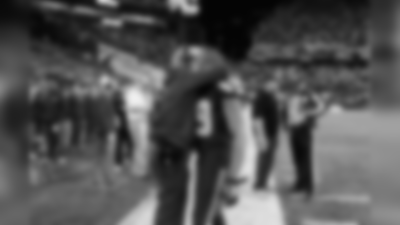 Head coach Pete Carroll hugs receiver Doug Baldwin just before kickoff.