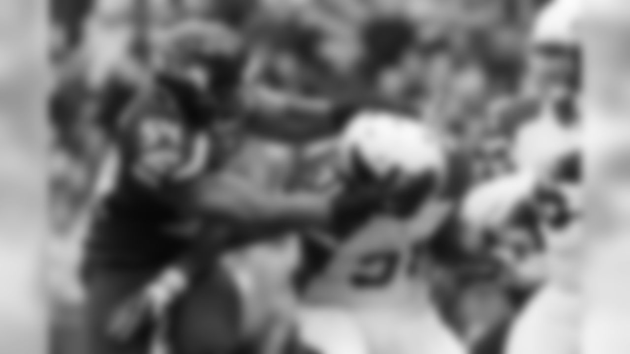 Seattle's Bobby Wagner briefly grasped the helmet of Arizona's David Johnson before making the tackle.
