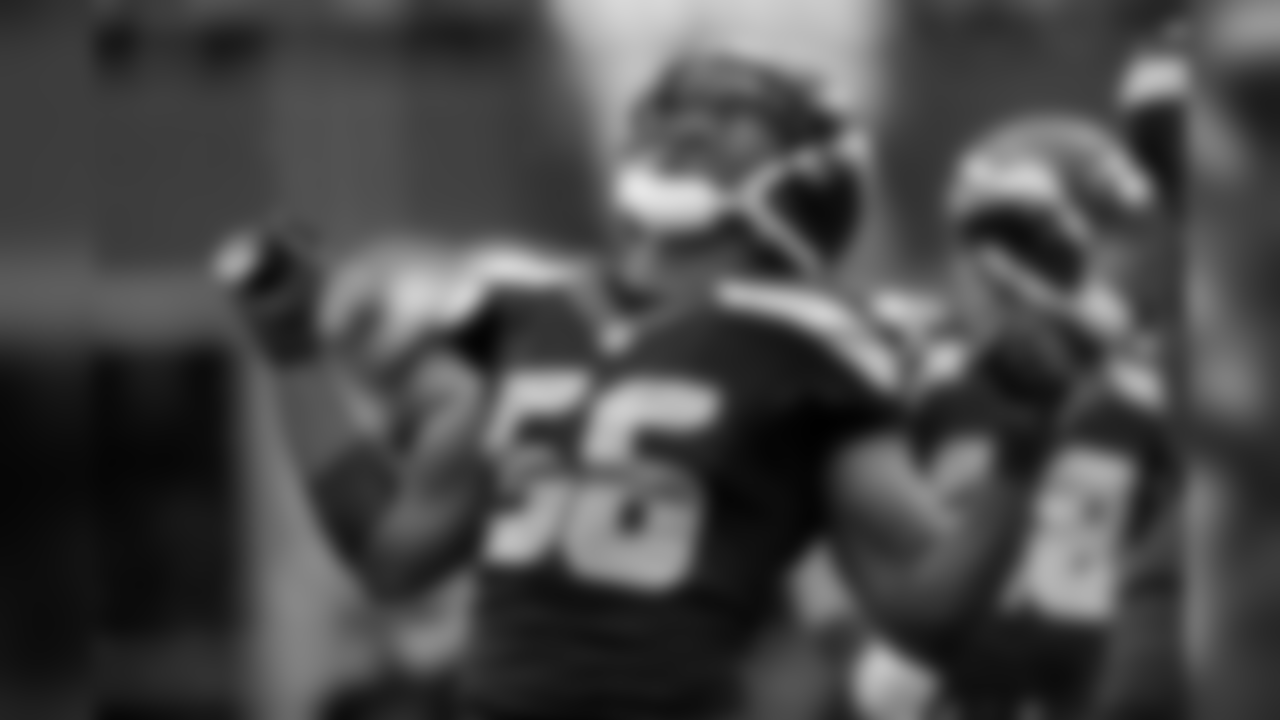 Cliff Avril celebrates after his big hit on Derek Carr.
