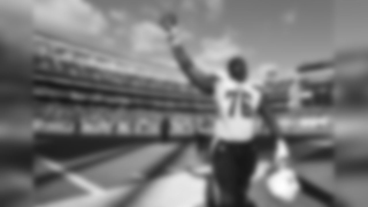 San Diego Chargers tackle D.J. Fluker celebrates after the Chargers defeated the Jacksonville Jaguars 33-14 in an NFL football game Sunday, Sept. 28, 2014 in San Diego. (AP Photo/Denis Poroy)