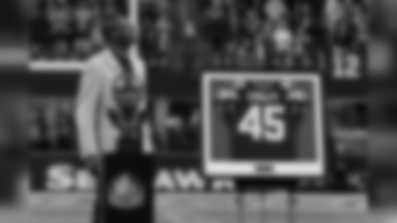 Kenny Easley looks towards the east rafters of CenturyLink Field as his jersey was revealed next to the retired numbers of other Seahawks greats Steve Largent, Walter Jones and Cortez Kennedy. The number 12 is also retired in honor of the fans.