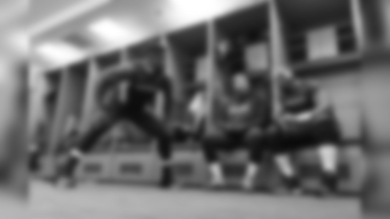 Offensive linemen Germain Ifedi, Mark Glowinski and J'Marcus Russell chat in the locker room prior to the game.