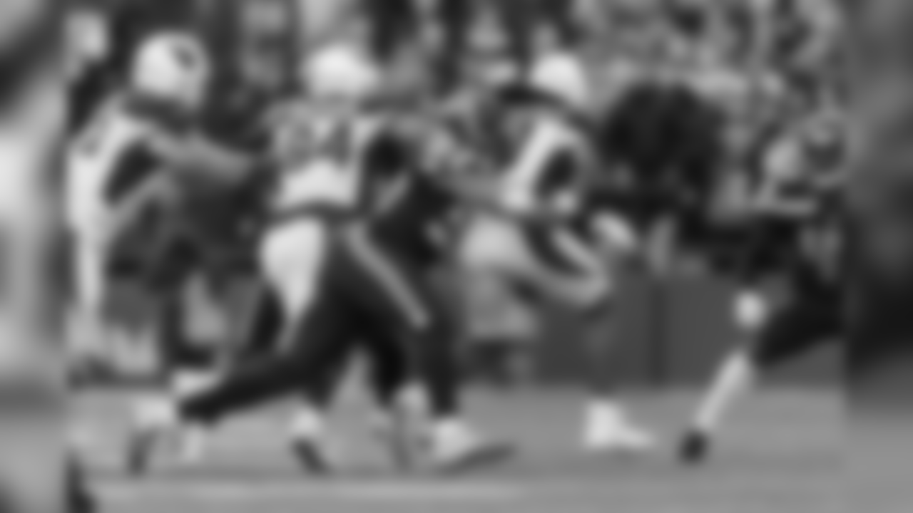 Seattle's K.J. Wright corrals Arizona receiver Larry Fitzgerald during the first quarter.