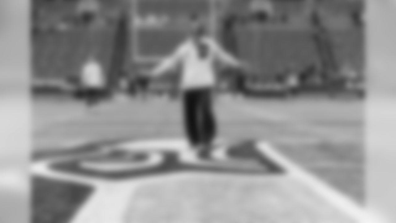 Russell Wilson listens to music on his Bose headphones during his pregame ritual.