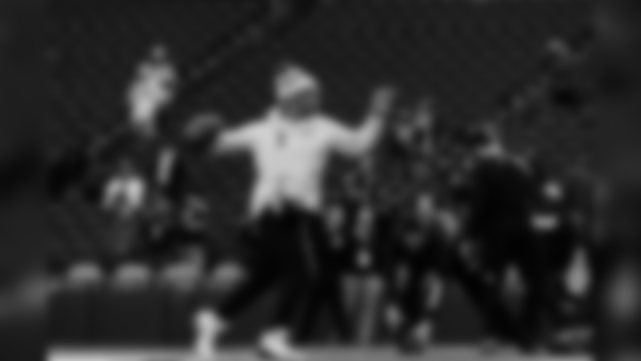Quarterback Russell Wilson warms up before the game.