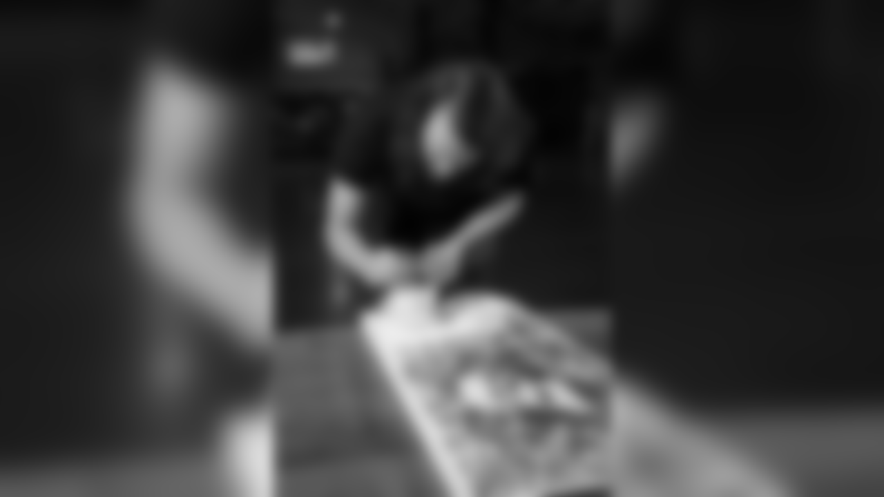 Latte artist Kale Lotton works on a latte logo for the Seahawks schedule release video.