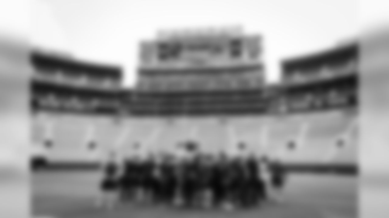 The Seahawks gather on the turf at Lambeau Field after a brief visit on Saturday.