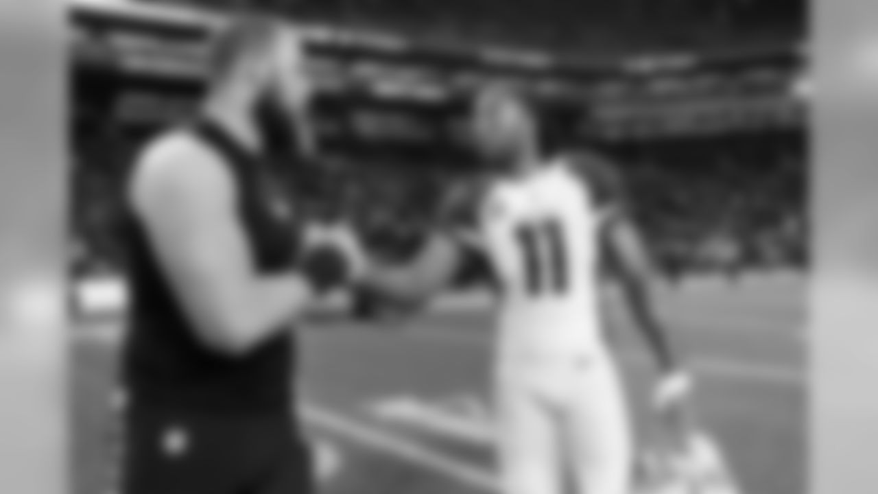 Seattle's Justin Britt congratulates Arizona's Larry Fitzgerald after the game.