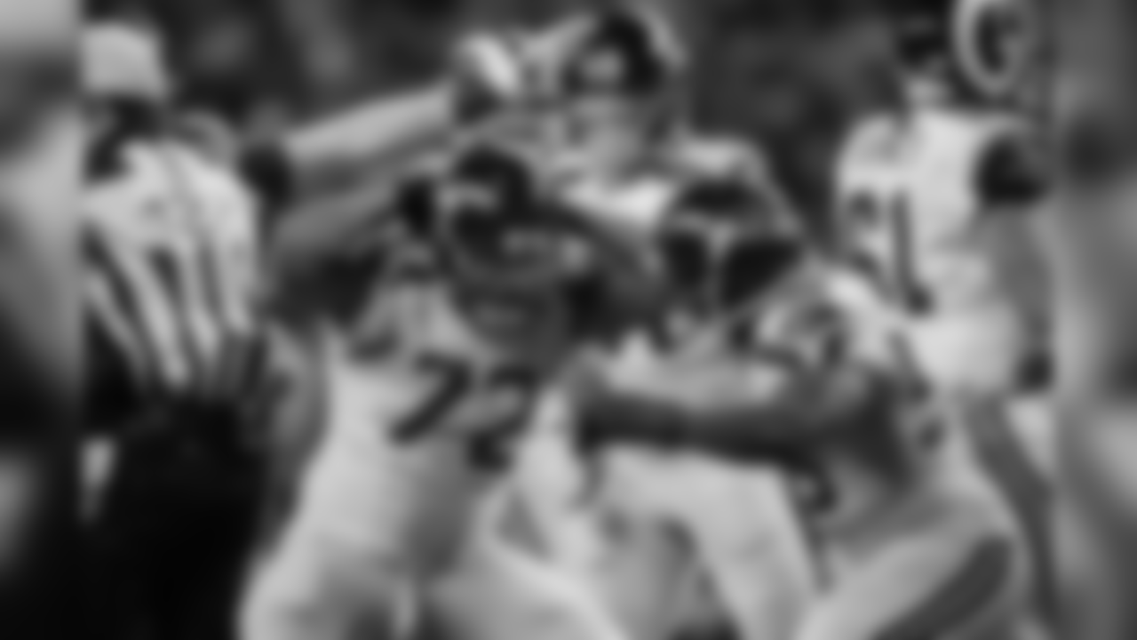 Michael Bennett celebrates his sack with Cliff Avril.