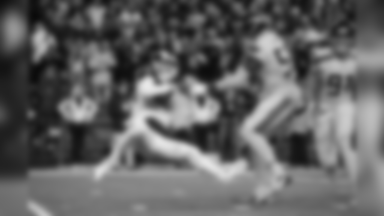 Frank Clark slings down Rams quarterback Jared Goff.