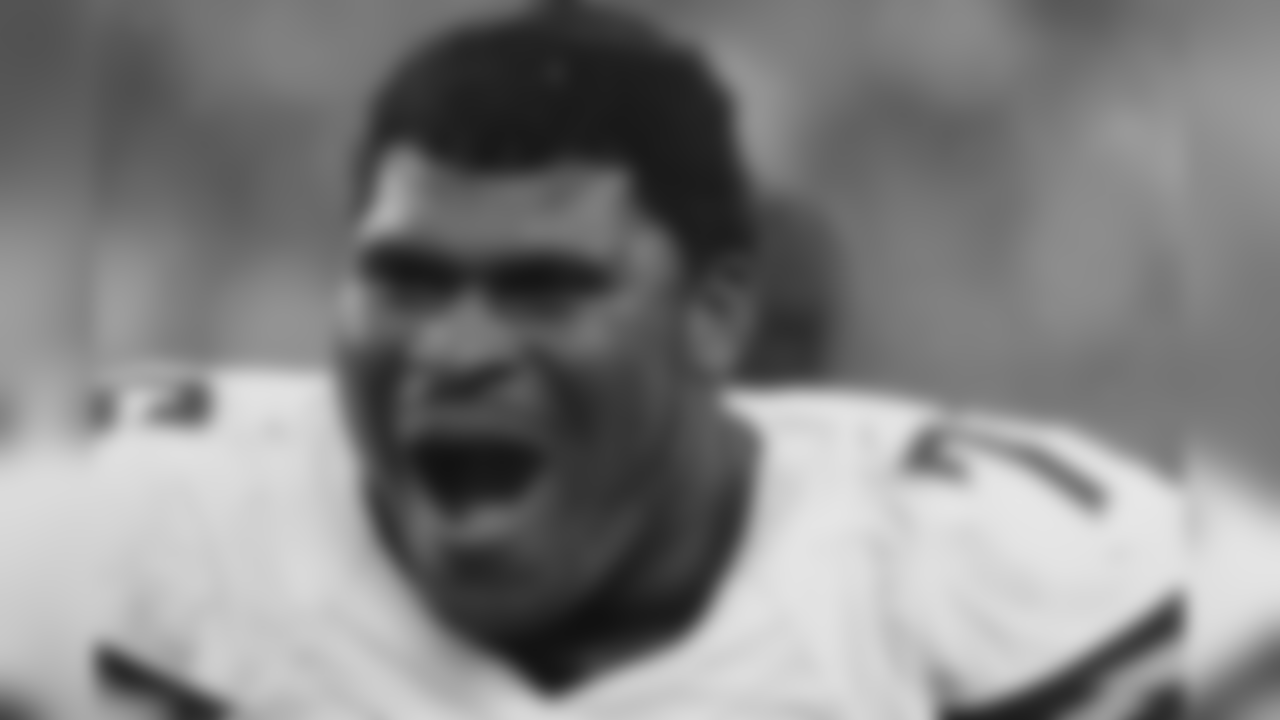 San Diego Chargers offensive tackle D.J. Fluker watches from the sidelines in the second half of an NFL wild-card playoff football game against the Cincinnati Bengals Sunday, Jan. 5, 2014, in Cincinnati. (AP Photo/Tom Uhlman)