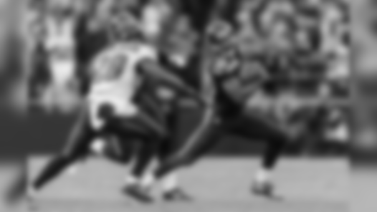 Seattle's Tyler Lockett looks for running room on a punt return in the third quarter.