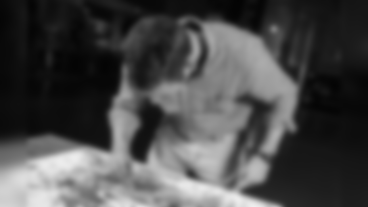 Jon Norquist from Coffee on Canvas (CoffeeOnCanvas.com) creates a piece of artwork for the Seahawks schedule release.