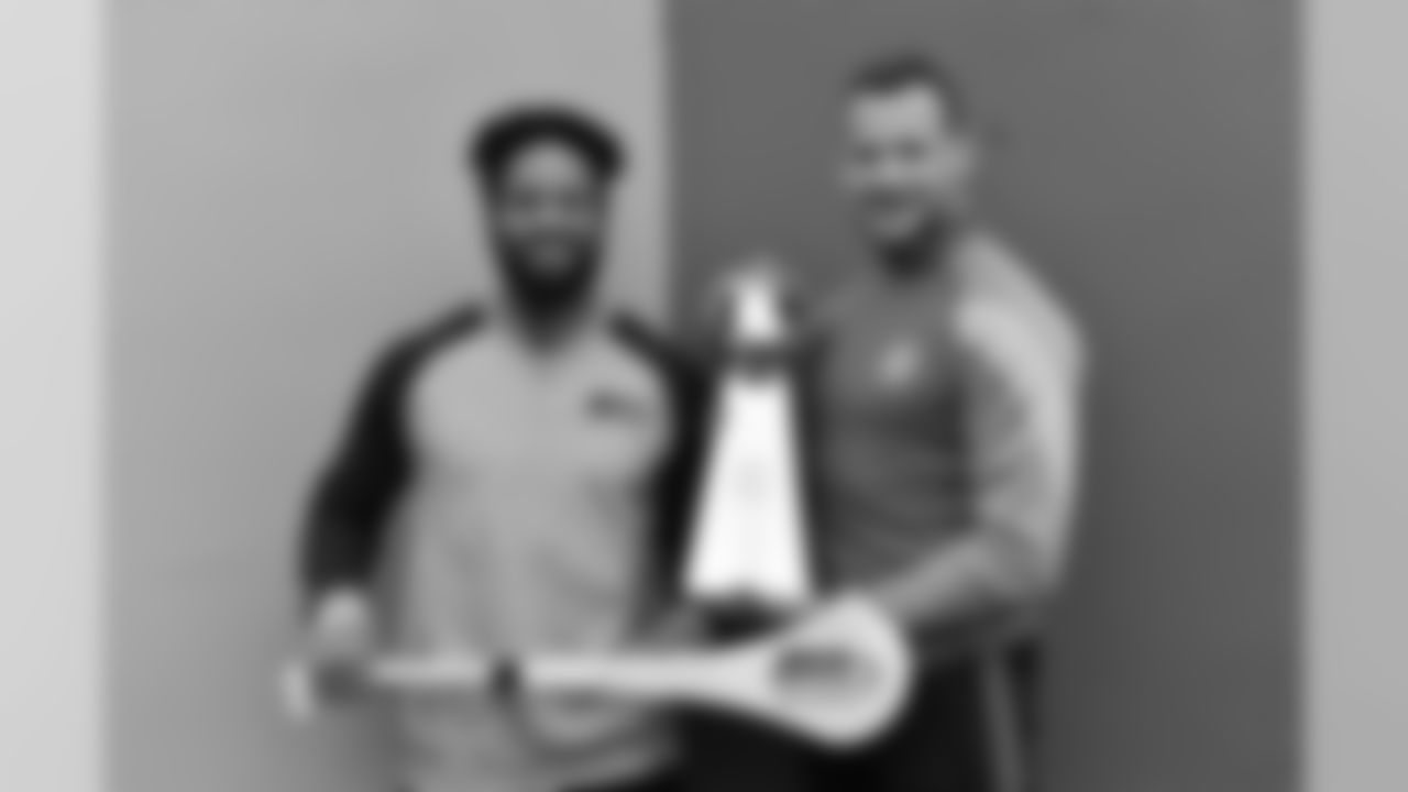 23 March 2018; Two-time Superbowl winning coach, Rob Ryan, Seattle Seahawks Earl Thomas, New York Giants Landon Collins and Baltimore Ravens Alex Collins, touched down in Dublin today for the NFL UK Live event, presented by Subway®. As part of their visit, Earl, Landon and Alex accompanied by Rob Ryan and the Vince Lombardi trophy put their athleticism to the test today at Dublins Clanna Gael Fontenoy GAA Club, where hurling legend Jackie Tyrell, and Dublin football legend attempted to teach them the skills of our national sports. The NFL UK Live event, presented by Subway®, will take place tomorrow (Saturday, 24th March) at Dublins Convention Centre where Rob, Earl, Landon and Alex will also be joined by the Philadelphia Eagles Jay Ajayi for an evening of entertainment, hosted by Sky Sports presenter, Neil Reynolds. Doors for the event open at 6pm, with the live show kicking off at 7.30pm. Tickets for the event, which are free-of-charge, are available at: www.nfluk.com/events/Dublin.html . Pictured is Earl Thomas of the Seattle Seahawks and former Kilkenny hurler Jackie Tyrel with a specially engraved hurley and the Vince Lombardi trophy at Clanna Gael Fontenoy GAA Club, Irishtown, Dublin Photo by Brendan Moran/Sportsfile