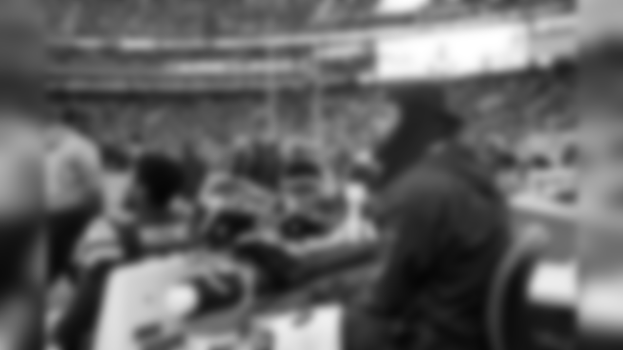 Injured cornerback Richard Sherman watches from behind the Seahawks bench.