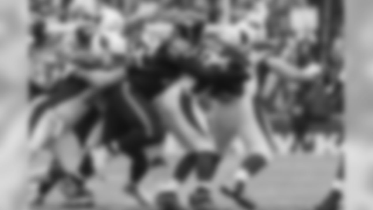 Ahtyba Rubin tackles Arizona's David Johnson early in the contest.