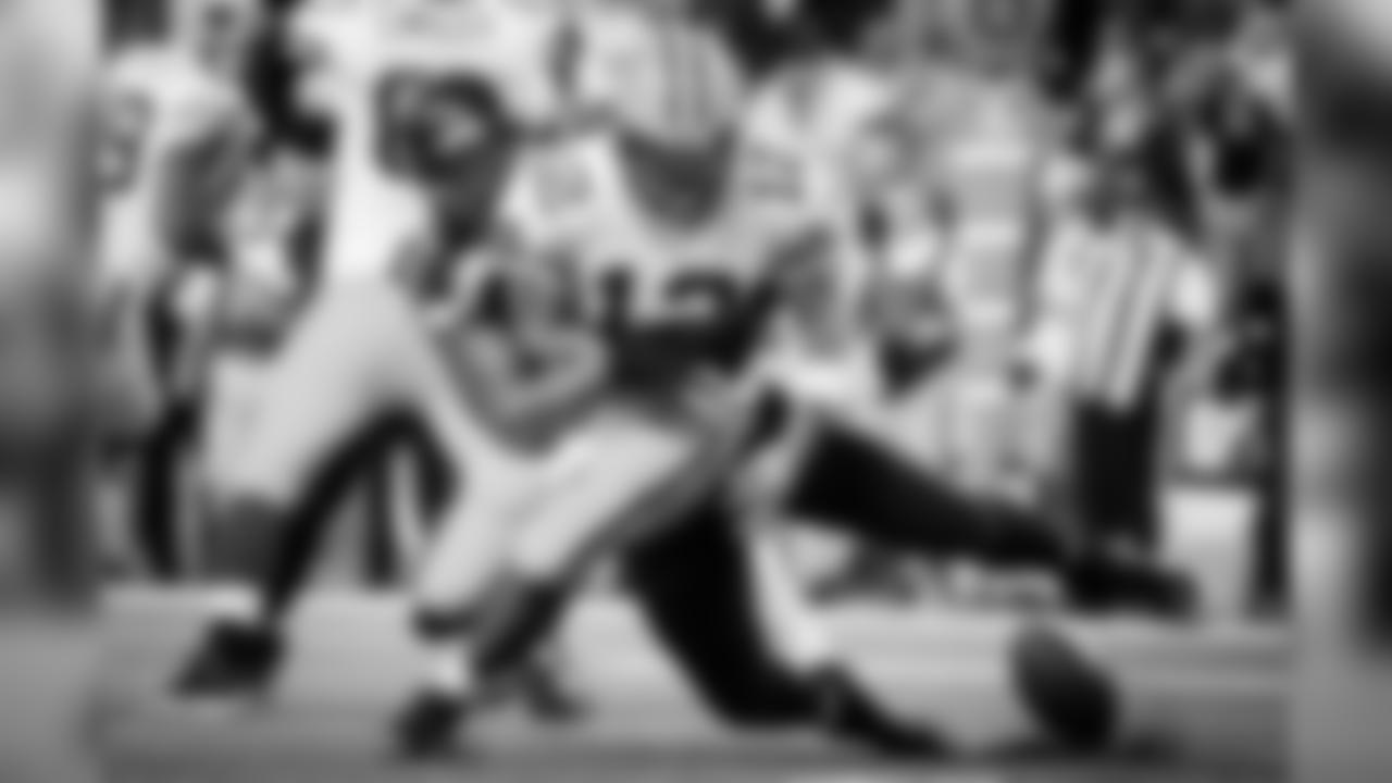 Seattle's Michael Bennett gets a strip sack as he knocks the ball out of the hands of Green Bay quarterback Aaron Rodgers that resulted in a safety.