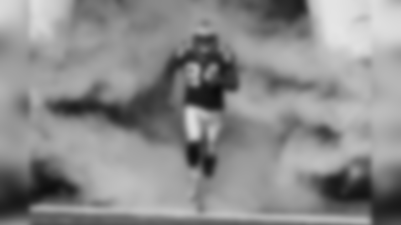 Carolina Panthers tight end Ed Dickson (84) runs onto the field during player introductions before an NFL regular season football game against the Minnesota Vikings on Sunday, Dec. 10, 2017 in Charlotte. The Panthers won, 31-24. (Ric Tapia via AP)