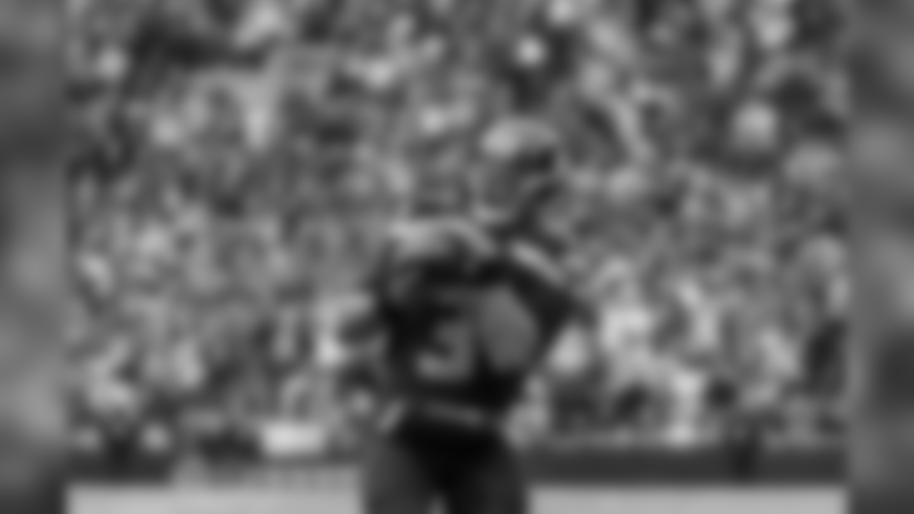 Seahawks quarterback Russell Wilson catches a pass from receiver Doug Baldwin on a trick play in the third quarter.