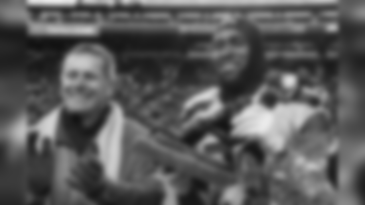 Steve Largent presents the Steve Largent award to Kam Chancellor before the game.