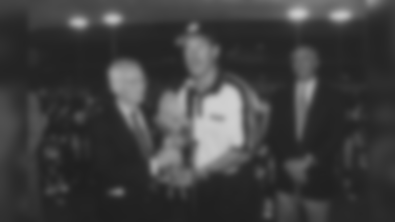 Dan Rooney holds the American Bowl trophy with Coach Bill Cowher following their victory over the Chicago Bears in Ireland.