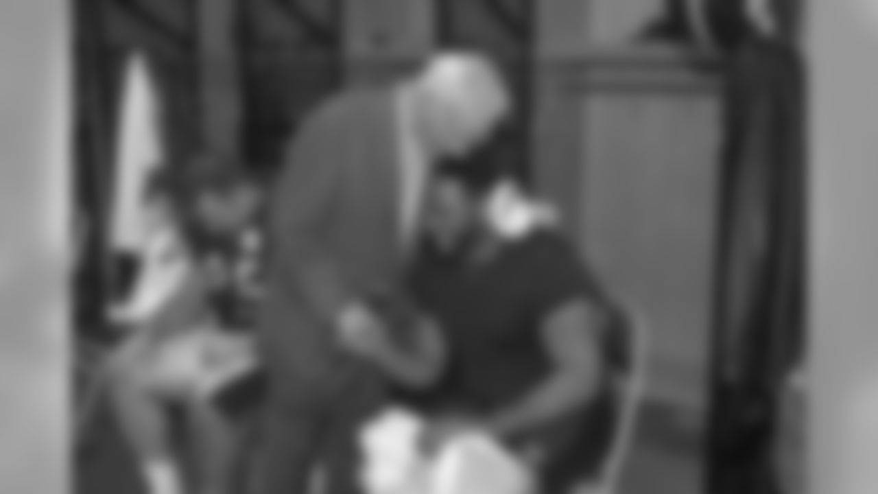 Dan Rooney hugs Jerome Bettis after a Division Round win against the New York Jets January, 15 2005.