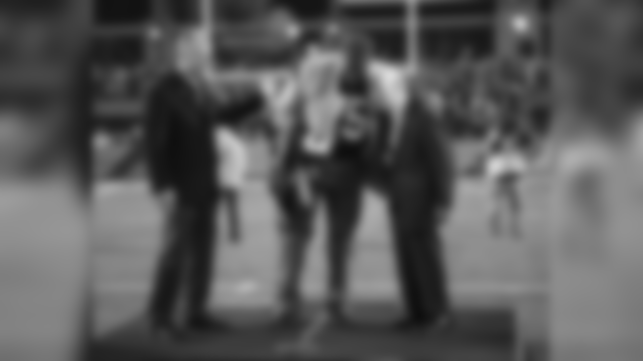 Joe Greene gives Dan Rooney a hug during his jersey retirement at Heinz Field.