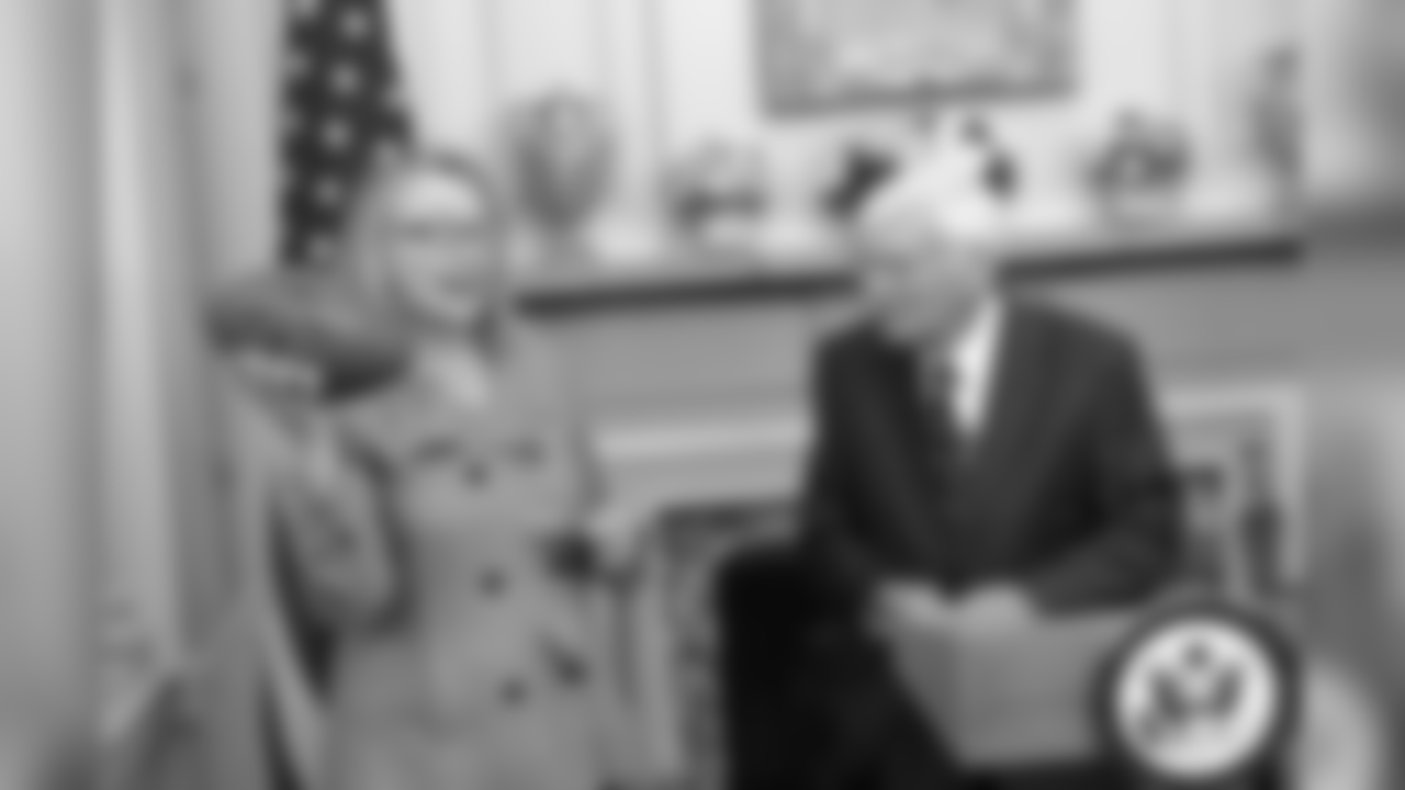 Dan Rooney stands with Secretary of State Hillary Clinton during a flag ceremony in 2013.