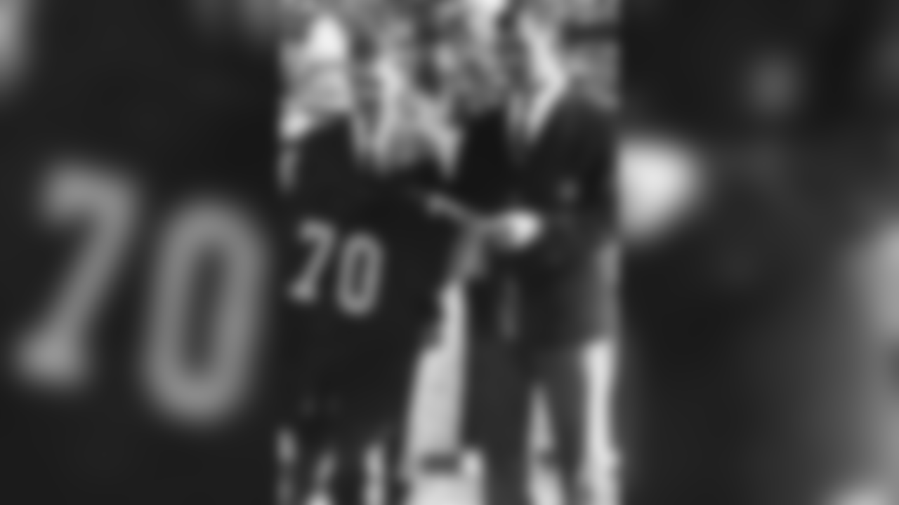Dan Rooney stands with Ernie Stautner during a jersey retirement ceremony.