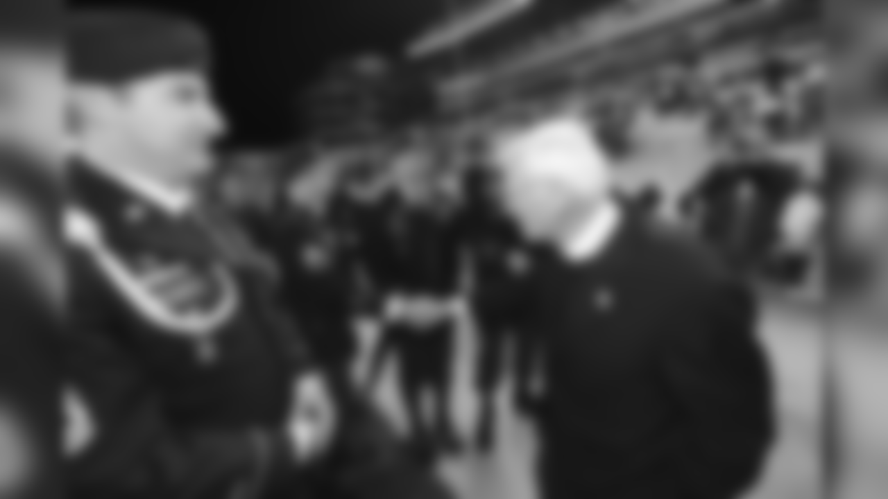 Dan Rooney shakes hands with a group of Navy Seals before a game against the Baltimore Ravens, November 6, 2011.