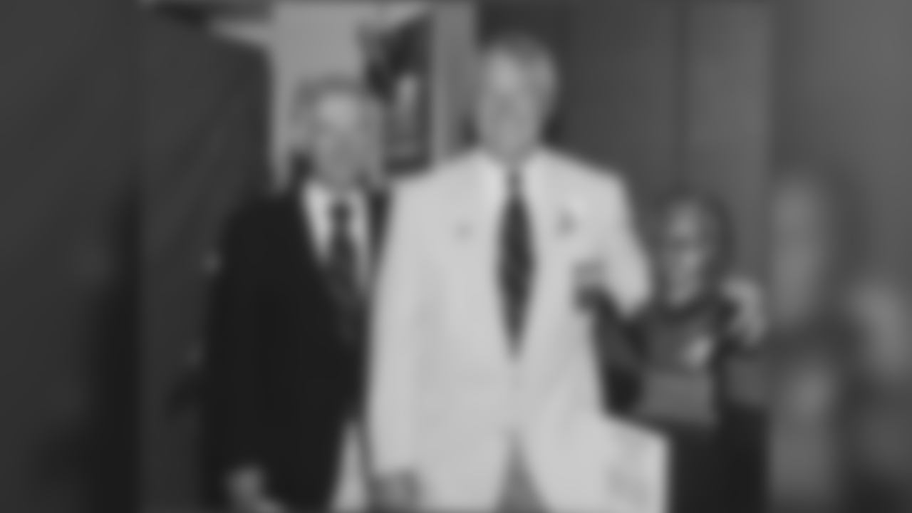 Dan Rooney stands along side Chuck Noll and his bust during the Hall of Fame induction ceremonies in 1993.