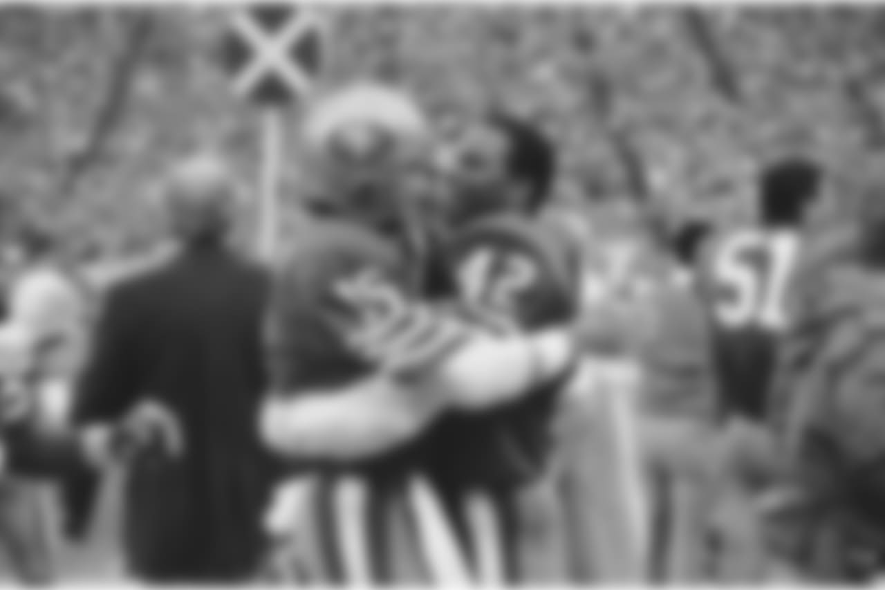 QB Joe Montana and S Ronnie Lott