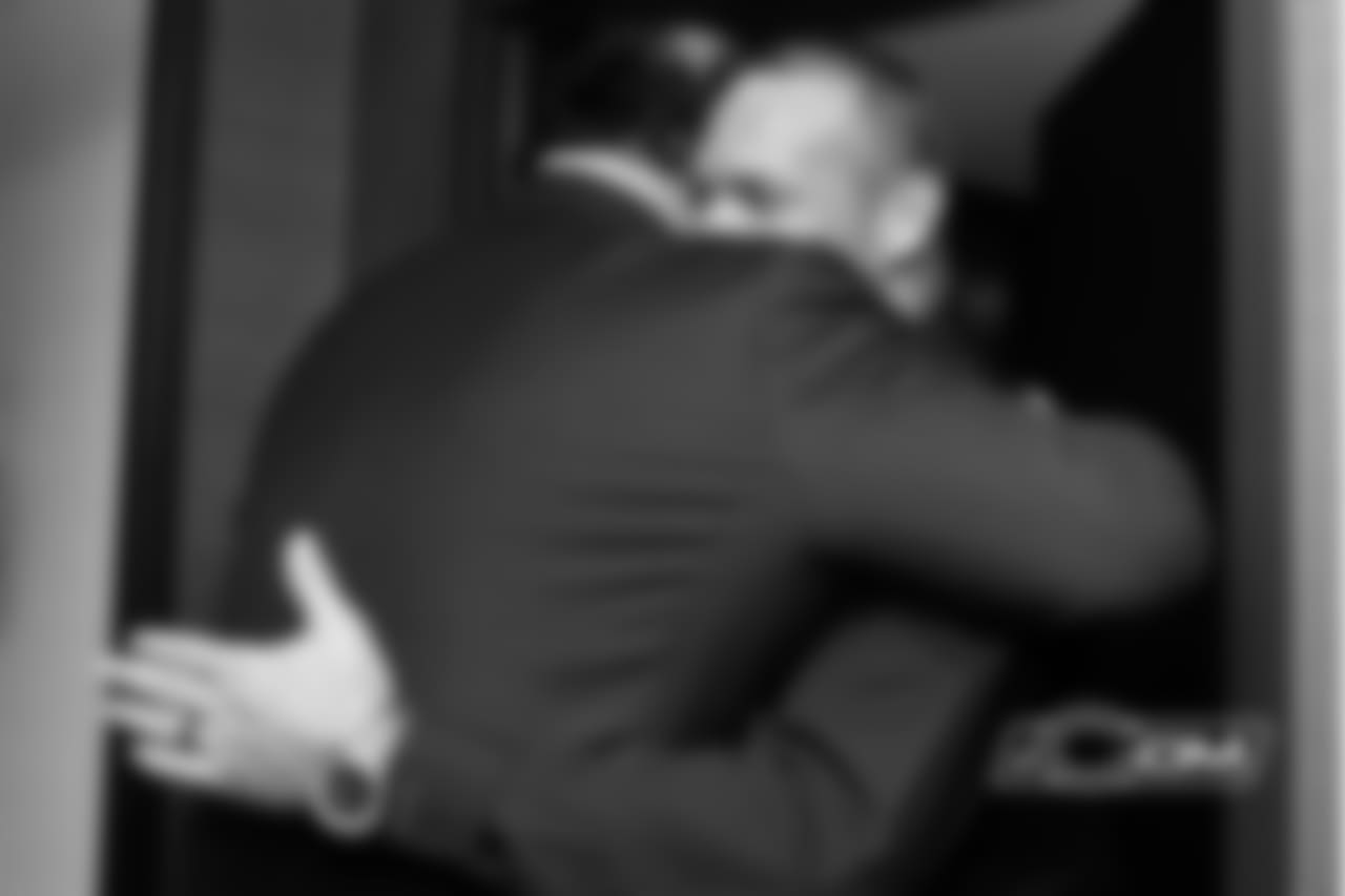 Brian Urlacher shares a moment with Pro Football Hall of Fame President David Baker.