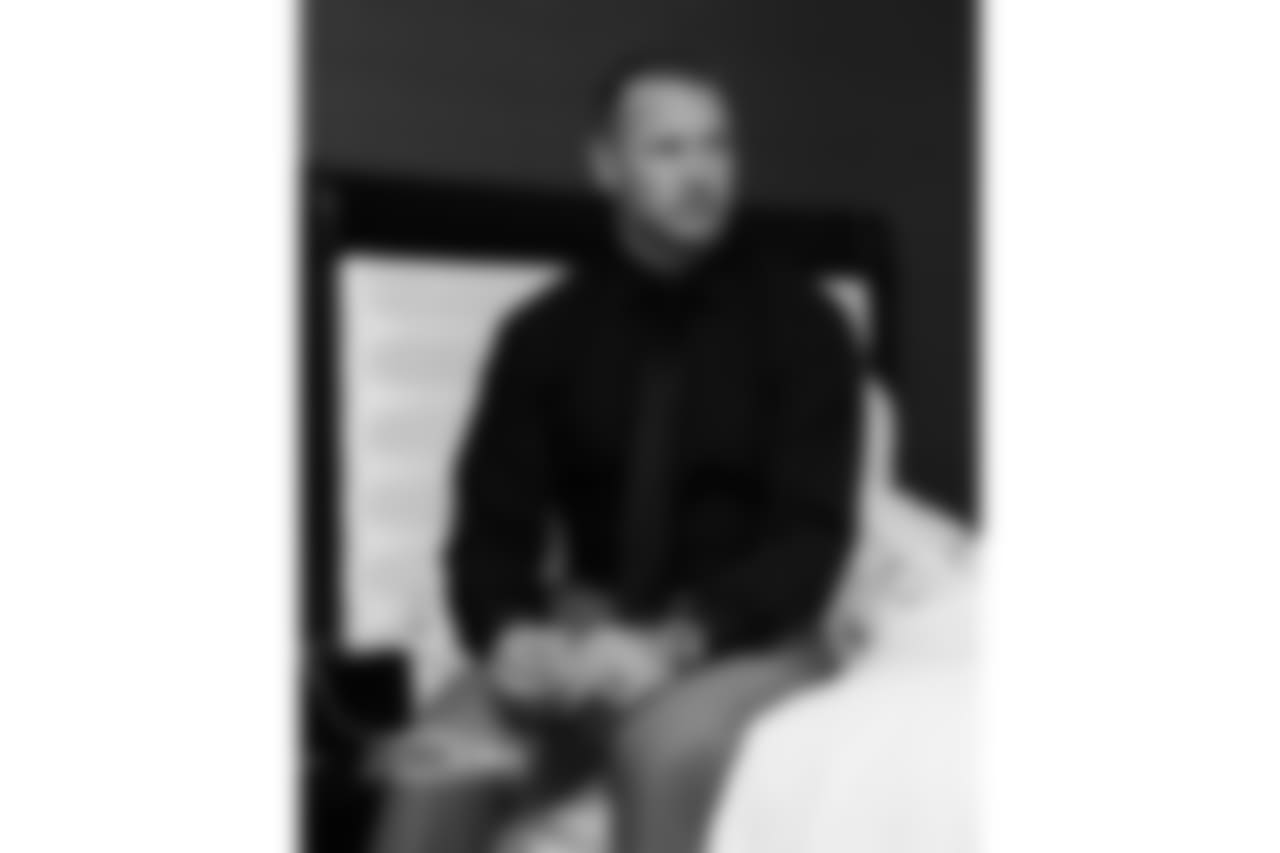 Brian Urlacher eagerly waiting for a knock on his hotel room door to find out if he's been voted into the Pro Football Hall of Fame.