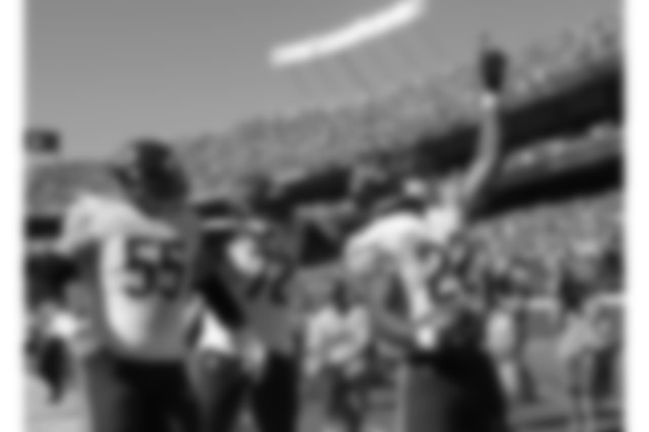 Chicago Bears running back Matt Forte celebrates with center Hroniss Grasu and offensive tackle Charles Leno after scoring the game winning touchdown