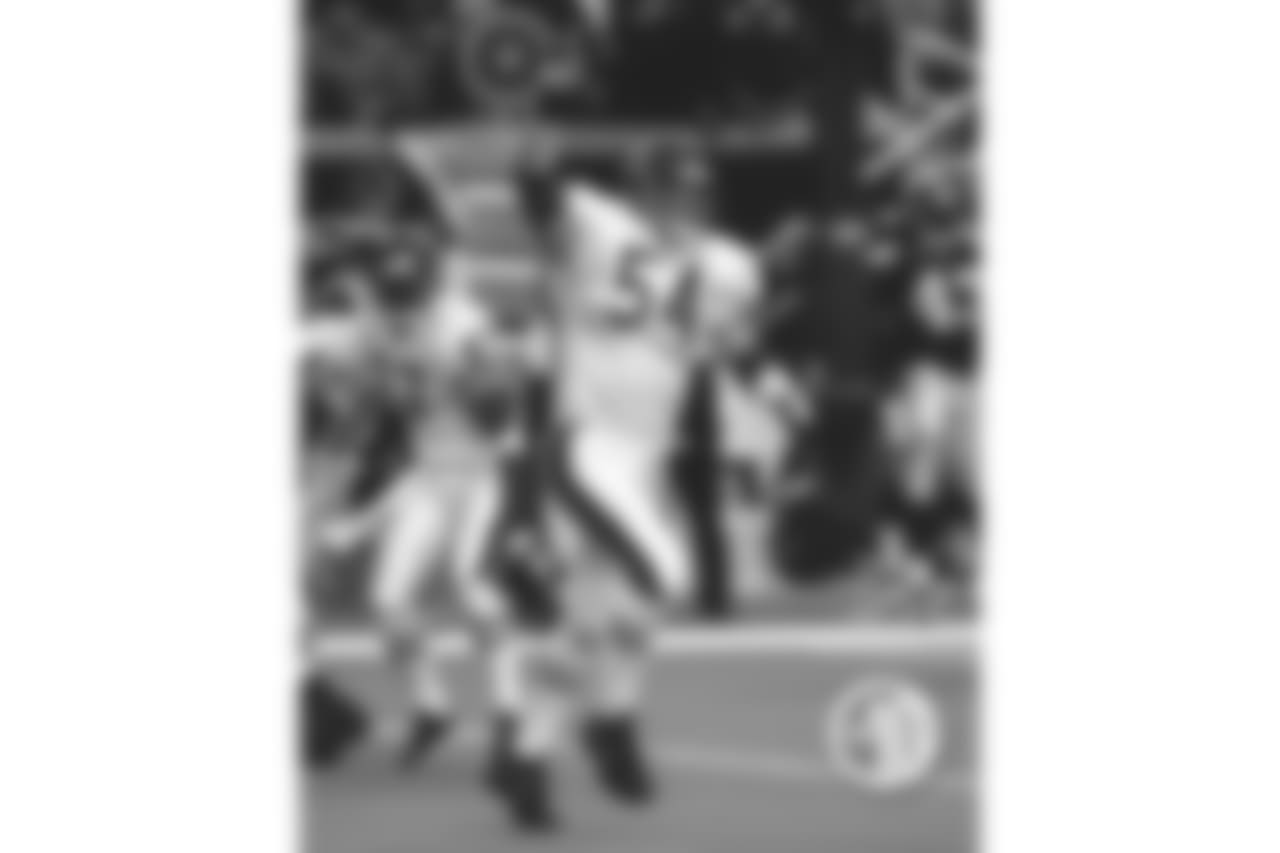 Urlacher helped hold elusive quarterback Michael Vick to 18 yards rushing and returned a Vick fumble 90 yards for a touchdown in a 31-3 rout of the Falcons Oct. 7, 2001 in Atlanta.