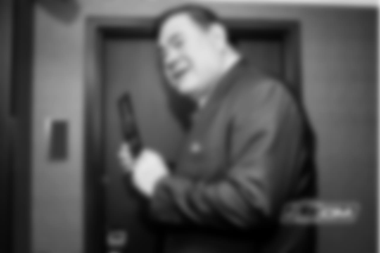 Pro Football Hall of Fame David Baker stops at Brian Urlacher's hotel room door.